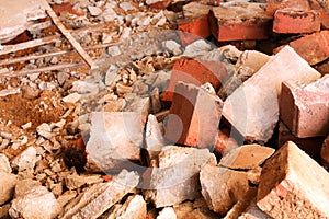 Dismantling, disassembling the floor. Smashed concrete and bricks floor. Destroying concrete surface. Renovation, old