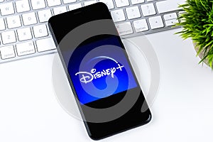 Disney+ logo on a smartphone screen.