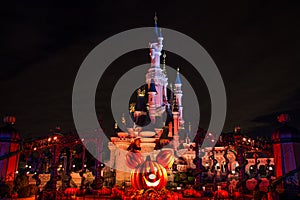 Disneyland Paris Castle during halloween celebrations at night