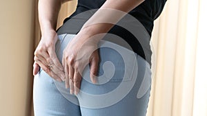 Disorder, Diarrhea, incontinence. Healthcare concept. Woman hand holding her bottom