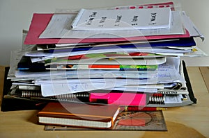 Disordered papers, clutter on a desk photo