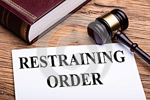 Restraining Order Documents Near Gavel And Law Book photo