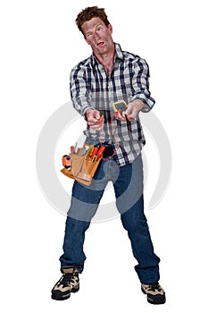 Disoriented man holding a multimeter photo