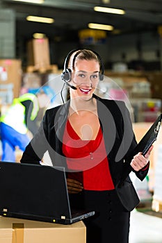 Dispatcher using headset at warehouse of forwarding