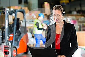 Dispatcher using headset at warehouse of forwarding