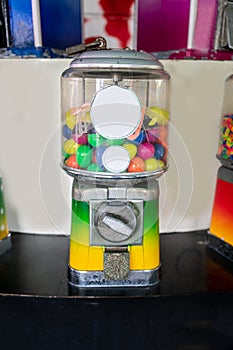 A dispenser of toys vending machine, full of rubber balls. Ret