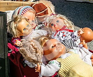 Display of 70s second hand plastic dolls for reusing toys