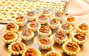 Display of assorted gluten free cupcakes with walnuts sitting o