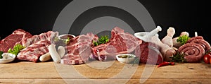 Display of assorted raw meats for barbecuing photo