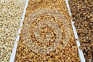 the display cases hold multiple assortment of nuts and seeds,