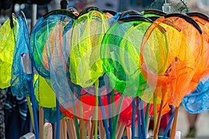 Display of colorful children fishing nets for beach