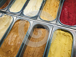 Display of colorful  ice creams in metal tubes