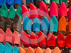 Display of colorful Moroccan slippers in souks in Fez Medina, Morocco photo