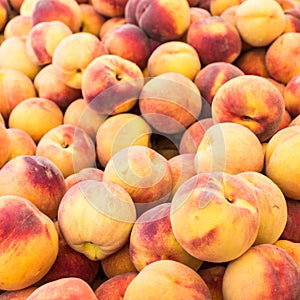 Display of fresh yellow peaches