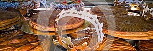 Display of galettes des rois, french kingcakes with a goden crown in a bakery