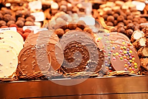 Display of multiple round crackers coat chocolate in Barcelona Market