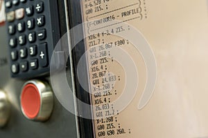 Display of programmable machine with big red button. shallow DOF