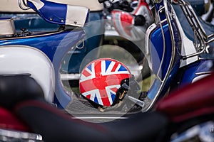 Display of scooters with Union Jack helmet