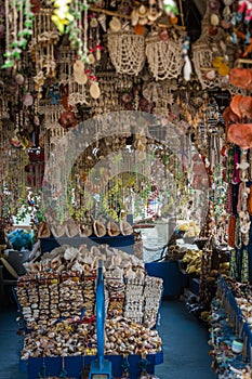 Display of Seashell wind chimes and sea sponge on a souvenir shop