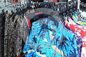 Display of several Hawaiian themed collared shirts for sale