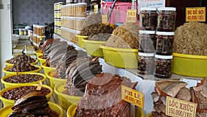 Display shelves selling fish sauce products at Chau Doc market, Vietnam