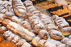 Display of traditional doughnuts on sale at Christmas market stall in Austria