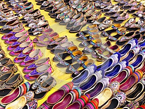 Display of traditional shoes at the street market in Jaipur, Ind photo