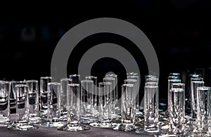 A display of transparent glass vases on black background. Concept of interior design and decoration