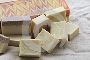 Display of a variety of soaps on linen background photo