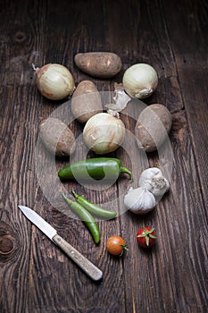 Display of veggies and a small knife.