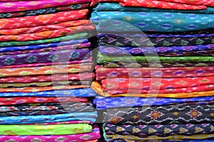 Display of vivid and colorful Indian Sari, India textile, selective focus