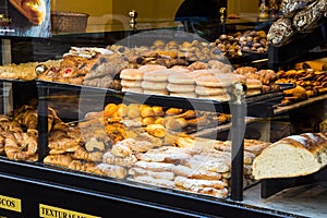 Display window of a bakery and pastry shop in Maisonnave Avenue of Alicante, assortment