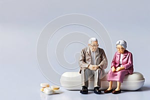 Family Health: Miniature Figurines amidst Oversized Pills photo