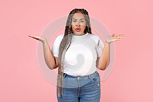 Displeased African American Obese Female Posing Over Pink Background