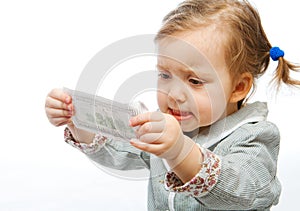 Displeased baby with banknote photo