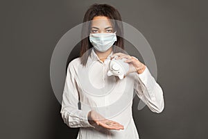 Displeased black woman in medical mack without money. Financial crisis and global pandemic covid-19 concept photo