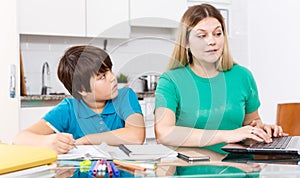Displeased family doing homework