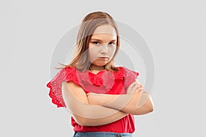 Displeased girl with crossed arms pouting