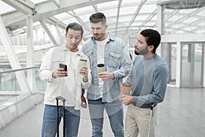 Displeased Males Using Smartphone Having Problem With Internet In Airport