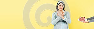 displeased pregnant woman showing reject gesture