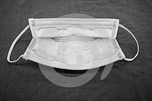 Disposable anti pollutant face mask with comfort strap isolated on grey