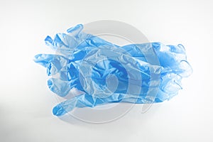 Disposable blue medical gloves on a white background