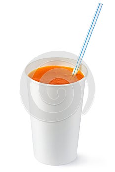 Disposable cup of orange fizzy drink and straw photo