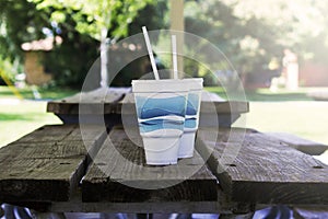 Disposable Cups On Picnic Table