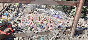 Disposable cups in the trash .