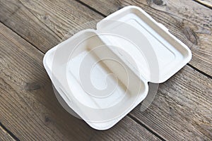 Disposable eco friendly packaging containers on wooden table  Service food order online delivery food box take away boxes