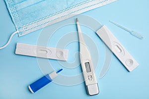 Disposable express test kit for hepatitis on light blue background, flat lay