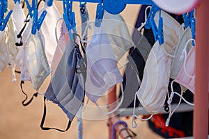 Disposable medical mask hanging on pegged clothesline for reused in some case, Due to lack of disposable medical mask of novel