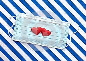 Disposable medical mask on striped blue  white background with red hearts on it against bacteria and viruses. Stop spread of