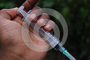 Disposable medical syringe in the hand